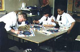 Year 10 pupils paint into printed designs