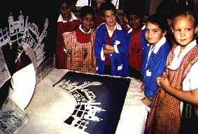 Year 4 screen printing the centre of the banner