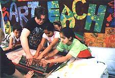Apprentice working with local school children