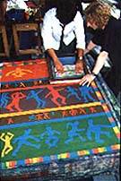 Year 10 pupil from St. Georges RC Secondary School printing the banner