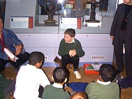 Pupils sitting on stool at the Horniman Museum