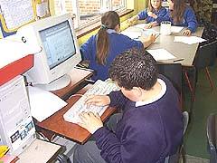 Pupil completing worksheet form
