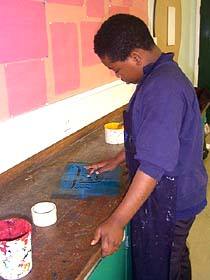 mono printing areas of fabric to make up hats