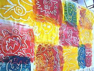 mono printing areas of fabric to make up hats