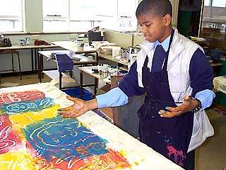 mono printing areas of fabric to make up hats