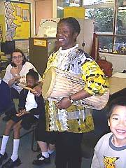 Playing the talking drum